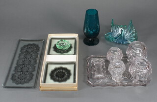 A 1930's moulded clear glass dressing table set comprising tray, 2 large lidded jars and covers, 2 small lidded jars and covers and a small tray, 5 dishes and 2 vases 