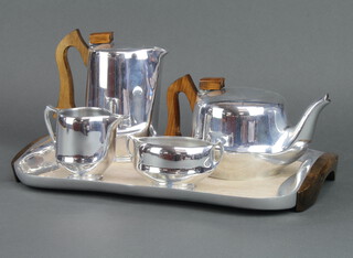 A Picquot ware tea and coffee service comprising coffee pot, teapot, sugar bowl, milk jug and tray 