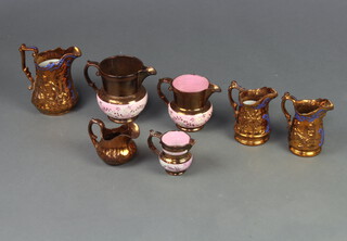 A Victorian lustre jug with moulded decoration 18cm and 6 other jugs (3 a/f)