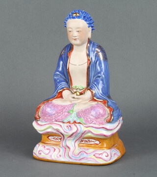 A modern Chinese figure of a seated deity 30cm 