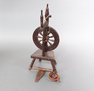 A 19th Century turned oak spinning wheel 89cm h x 31cm w x 20cm d (requires attention)