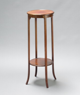 An Edwardian circular mahogany 2 tier jardiniere, raised on outswept supports 96cm h x 35cm diam. (frame is loose, some water marks) 