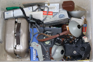 A Lacer Prinz projector, various camera instructions etc, contained in a clear plastic box 