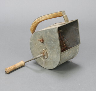 A German metal hand held seed broadcaster 29cm x 15cm x 31cm 