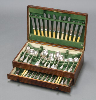 A canteen of mixed silver plated flatware contained in an oak canteen box 