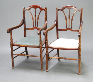 A pair of Edwardian beech framed open arm chairs with vase shaped slat backs and upholstered seats, raised on turned supports 94cm h x 50cm w x 54cm d 