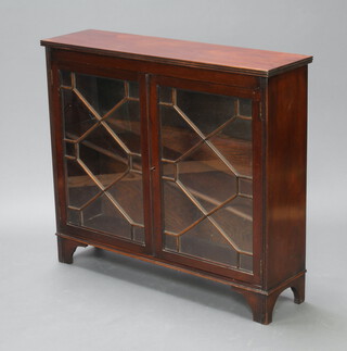 A Georgian style mahogany display cabinet fitted adjustable shelves enclosed by astragal glazed panelled doors, raised on bracket feet 91cm h x 104cm w x 28cm d  