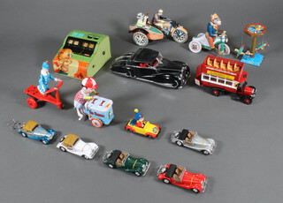 A tin plate keywind figure of an ice cream seller and minor modern tinplate toys and cars 