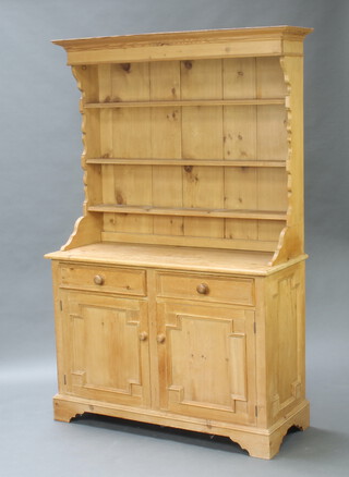 Greenwood Interiors Ltd., a Victorian style pine dresser with raised shaped back fitted 3 shelves, the base fitted 2 drawers above cupboard, raised on bracket feet 201cm h x 127cm w  x 50cm d 