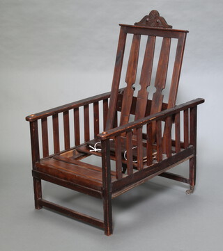 An elm slat back adjustable reclining chair with carved crest 114cm (3 slats are detached) 