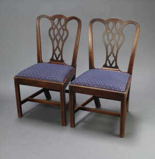 A pair of Georgian dining chairs with pierced backs and drop in seats on square legs 94cm 