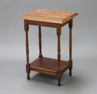 A rectangular oak 2 tier occasional table raised on turned supports 73cm h x 50cm w x 40cm d 