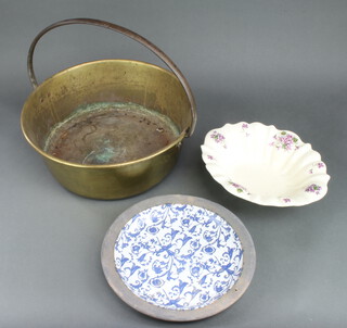 A brass preserving pan with steel handle 16cm x 41cm, a blue and white floral patterned dish 32cm and a Victorian style wash bowl 30cm 