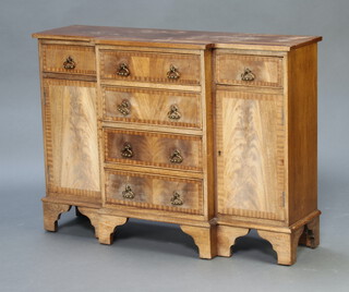 A Georgian style crossbanded and breakfront heavily bleached mahogany sideboard fitted 4 drawers flanked by cupboards, raised on bracket feet 76cm h x 104cm w x 33cm d (water marks to the top)