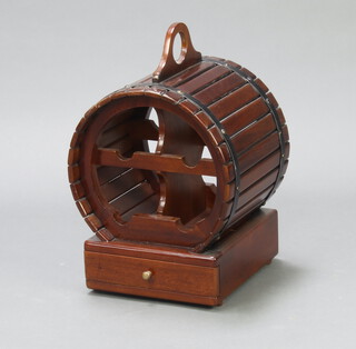 An oval barrel shaped hardwood 4 bottle wine rack the base fitted a drawer 52cm h x 33cm w x 30cm d  