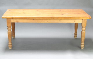 A Victorian style pine kitchen table raised on turned supports 178cm h x 198cm l x 106cm w (light contact marks) 