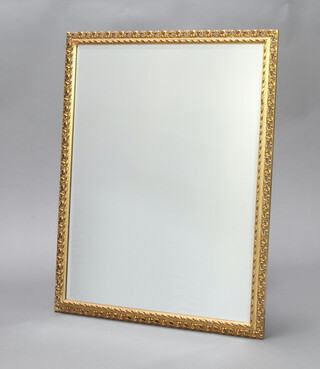 A rectangular bevelled plate wall mirror contained in a gilt frame 90cm x 72cm 
