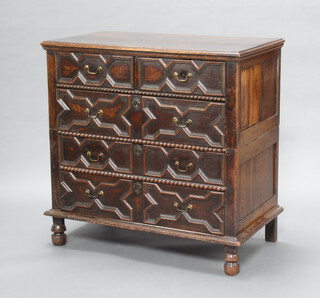 A Jacobean pine and oak chest with geometric mouldings, fitted 2 short and 3 long drawers with replacement brass swan neck drop handles, raised on bun feet  100cm h x 100cm w x 55cm d 