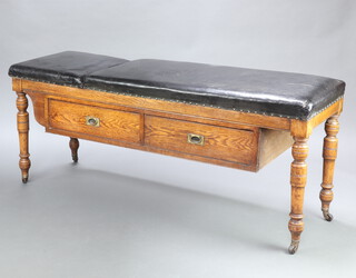 A Victorian oak doctor's reclining examination bed, the base fitted 2 drawers with brass countersunk handles, raised on turned supports 72cm h x 174cm w x 58cm d 