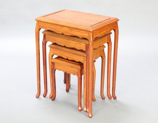 A nest of 4 rectangular Chinese hardwood interfitting coffee tables raised on cabriole supports 65cm h x 50cm w x 35cm d 