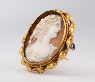 A Victorian yellow metal plated oval carved cameo brooch, portrait of a lady
