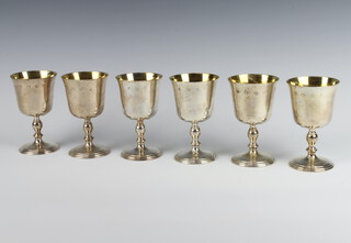 A set of 6 silver goblets of Georgian design and with gilt bowls, London 1974, 12.5cm, 860 grams 