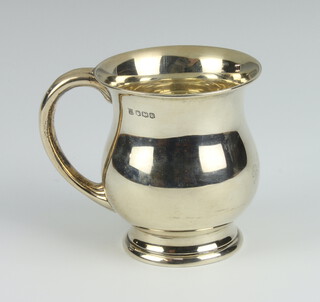 A silver baluster mug with engraved monogram, Sheffield 1927, 102 grams, 8cm 