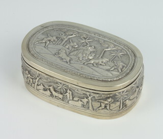 An Indian repousse rounded rectangular box decorated with a tiger hunting scene and animals 13cm x 8cm, 242 grams