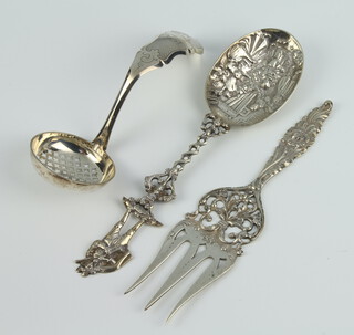 A Continental pierced repousse silver serving spoon, a sifter spoon and a serving fork 148 grams 
