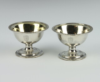 A pair of George IV circular silver pedestal table salts with gilt bowls Sheffield 1801, 146 grams, 7.5cm 
