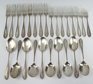 A part canteen of silver cutlery comprising 10 dessert spoons, 8 dinner forks and 8 dessert forks, Sheffield 1938, 1130 grams 
