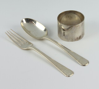 A silver napkin ring, fork and spoon, London 1947, 116 grams
