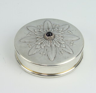 A circular Continental white metal pill box decorated with cabochon amethyst 5cm, 52 grams