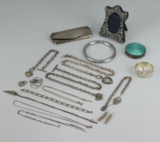 A silver spectacle case Birmingham 1912, a photograph frame, salt and condiment and minor items of costume jewellery etc, weighable silver 118 grams  