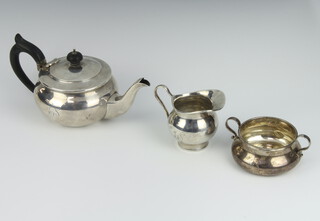 A bulbous silver teapot with ebony mounts and engraved monogram Birmingham 1949, a similar 2 handled sugar bowl London 1900 and a jug London 1922 gross weight 552 grams 
