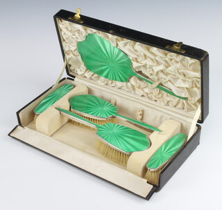 An Art Deco 5 piece silver and green guilloche enamel brush set comprising 2 hair brushes, 2 clothes brushes and a hand mirror, cased Birmingham 1935 