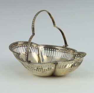 A silver quatrefoil pierced basket with swing handle, Sheffield 1911, 12cm, 60 grams