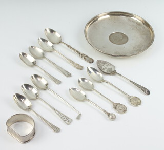 A silver shallow dish the centre with Churchill crown London 1971 and minor spoons, gross weight 274 grams 