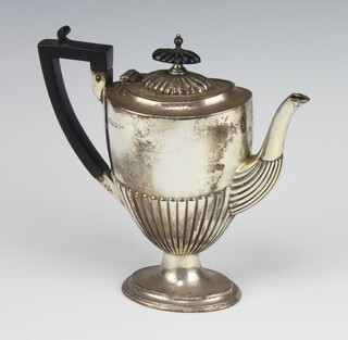 An Edwardian silver demi fluted coffee pot with ebony mounts Sheffield 1904, gross weight 382 grams 