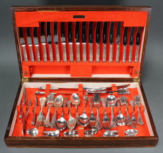 An oak canteen containing a set of silver plated Kings pattern cutlery for 4 