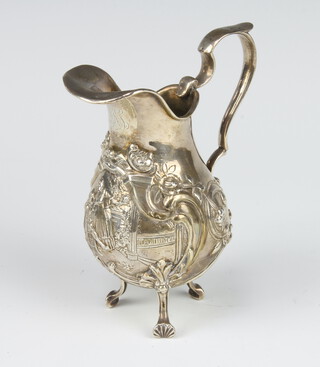 A Continental 925 standard Georgian design cream jug with repousse decoration a fete gallant scene, raised on shell feet 142 grams, 11cm 