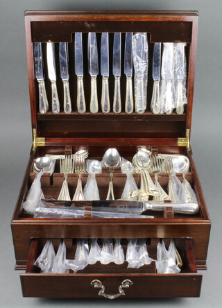 A mahogany canteen of silver plated cutlery for 6 with beaded decoration 