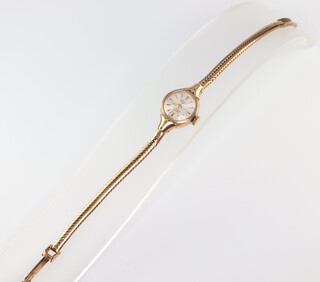 A ladys Rotary 9ct yellow gold wristwatch and strap 10 grams including glass 