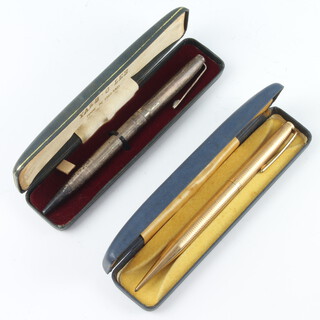 A silver Yard o'led propelling pencil and a gold plated ditto, boxed 