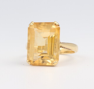 A yellow metal stamped 18ct emerald cut citrine ring size L, 6.2 grams 