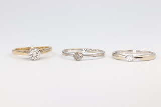 Three 9ct yellow gold diamond set rings, size N, 5 grams 