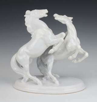 An Austrian porcelain group of 2 rearing white horses 32cm 
