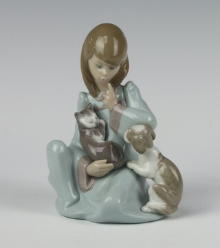 A Lladro figure of a girl holding a kitten 14cm 