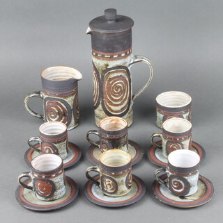 A Studio Pottery coffee set comprising coffee pot, milk jug, sugar bowl, 6 coffee cans and 6 saucers
