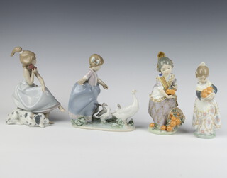 A Lladro figure of a Spanish girl collecting oranges 19cm, a ditto no.4841 17cm, a lady on a telephone 5466 20cm and a goose girl 18cm 